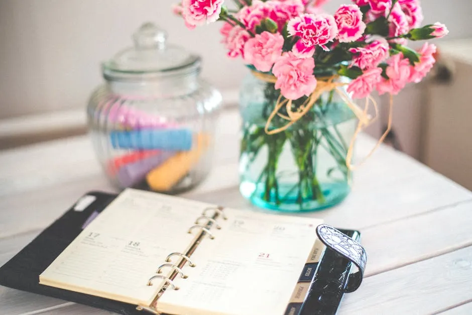 A clock, a printed calendar, and an open planner notebook on a wooden desk, suggesting a deliberate weekly time-management ritual