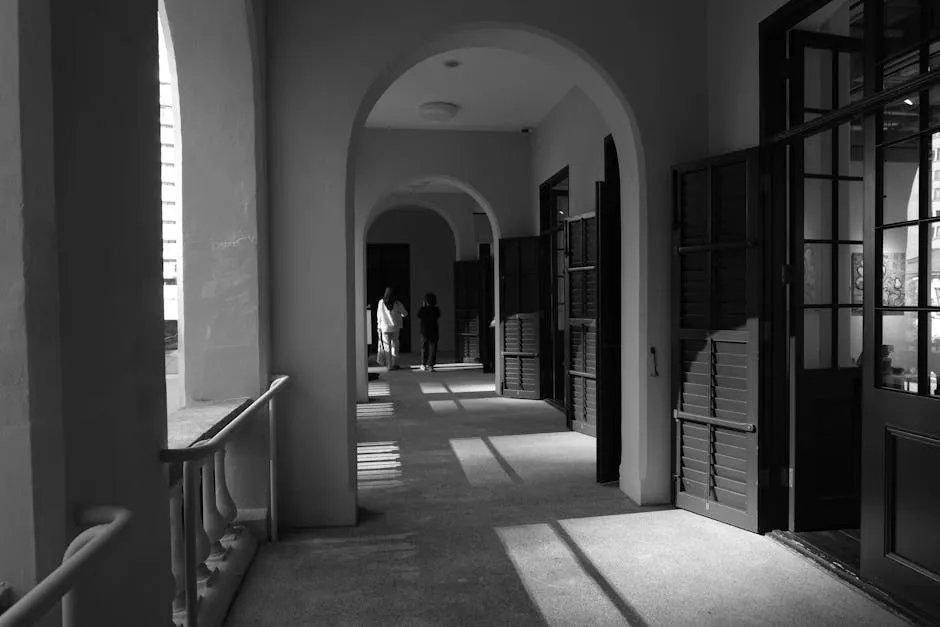 Two doors side by side in a plain corridor, suggesting a choice between two tools