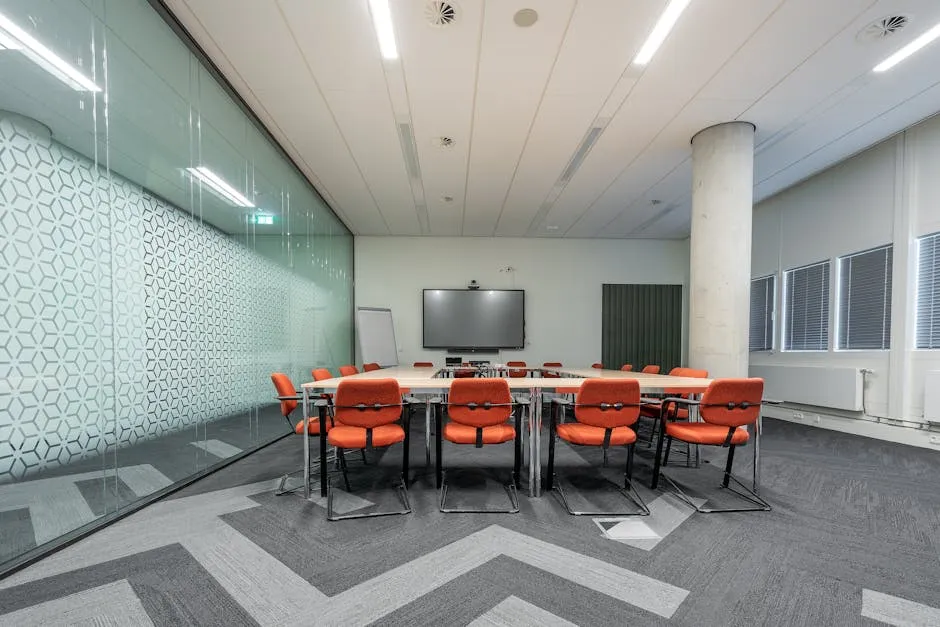 An empty boardroom with a long meeting table and chairs, ready for a quarterly review