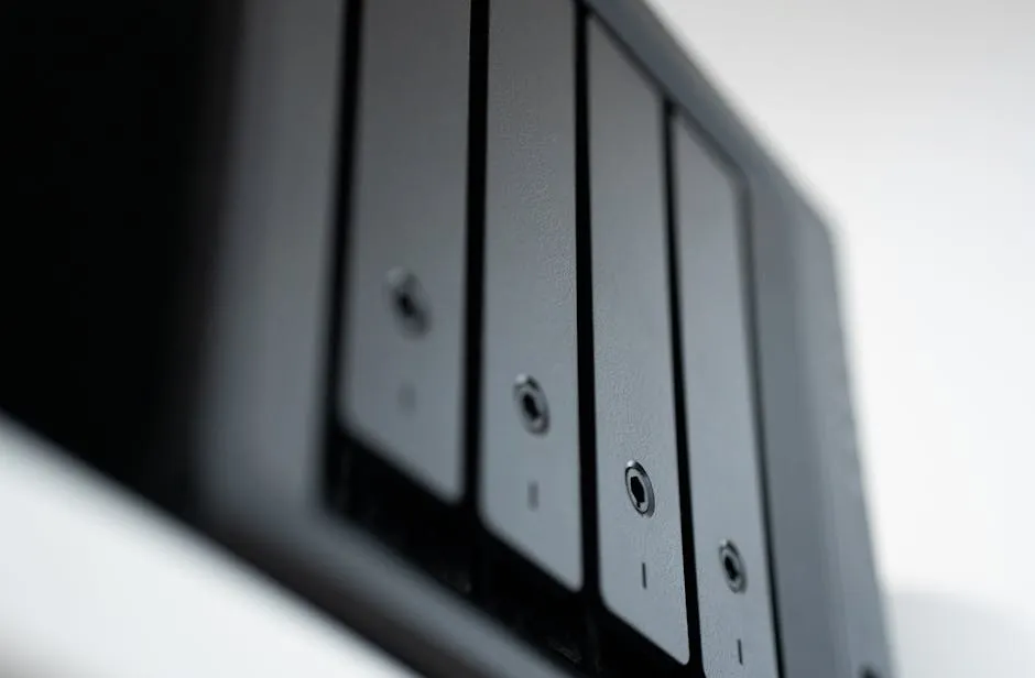 A row of backup hard drives in a storage rack, suggesting off-site data redundancy for disaster recovery